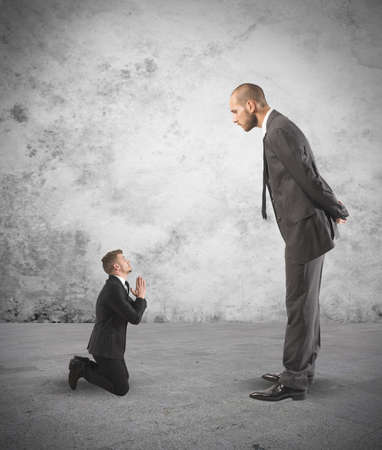 Concept of Businessman praying the big bossの写真素材