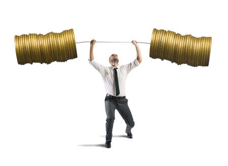 Concept of earning of a businessman who raises money as weightsの写真素材