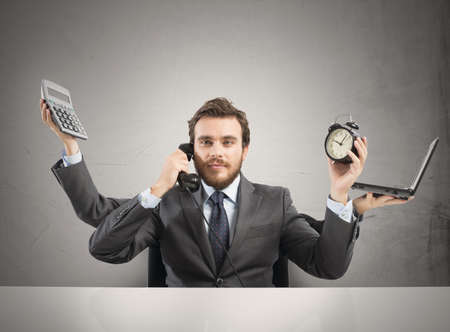 Concept of multitasking businessman who works with more arms Concept of multitasking businessman who works with more arms
