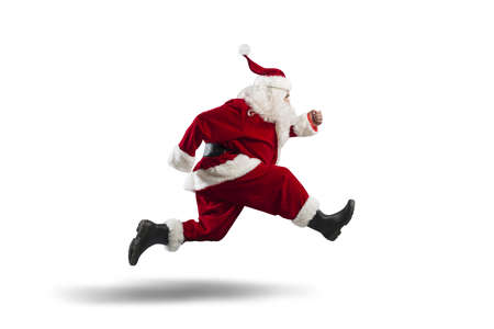 Running Santa Claus isolated on white backgroundの写真素材