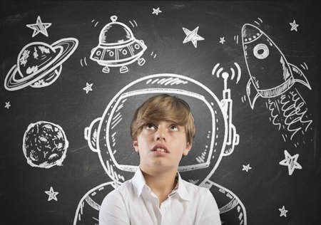 Child who dreams of being in space with open eyes