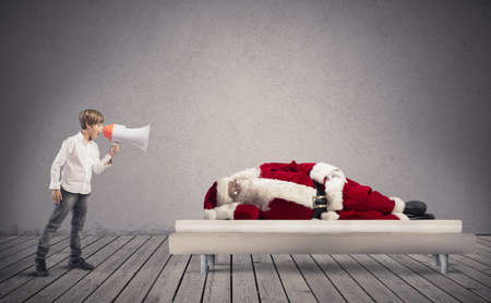 A child wake up asleep Santa Clausの写真素材