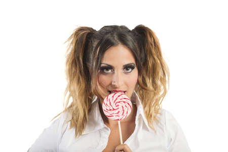 A sexy young girl licking a lollipopの写真素材