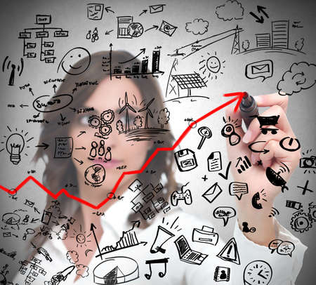 Successful businesswoman draws modern business concept with penの写真素材