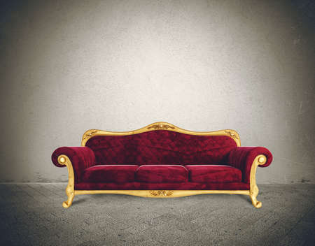 Success concept with comfortable retro sofa in a grunge roomの写真素材