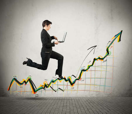 Concept of growth and success in business with running businesswomanの写真素材