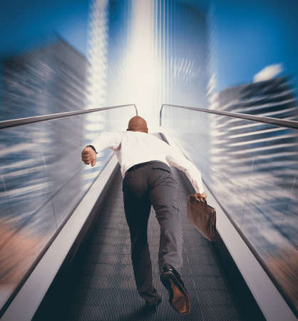 Concept of Easy way to success with businessman and escalatorの写真素材