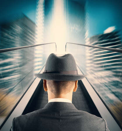 Concept of Easy way to success with businessman and escalatorの写真素材