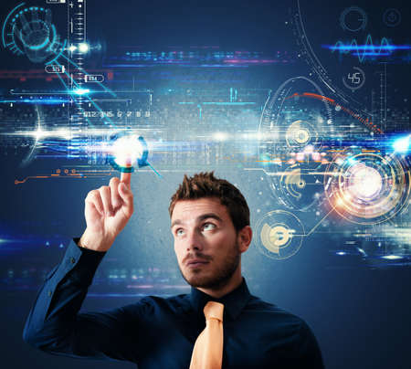 Businessman working with a futuristic touch screen interfaceの写真素材