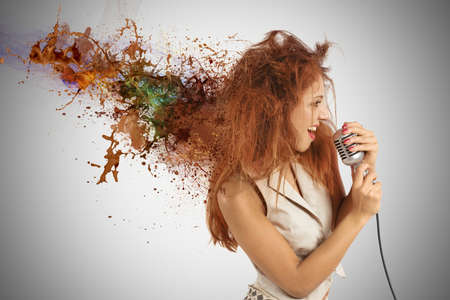 Concept of rock music with girl singer with motion effectの写真素材