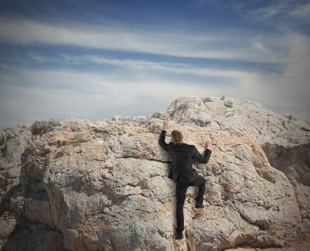 Concept of competition with businessman that climbing a mountain