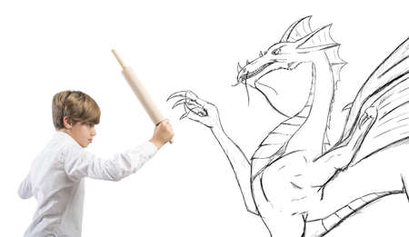 Concept of courageous child with drawing of dragonの写真素材