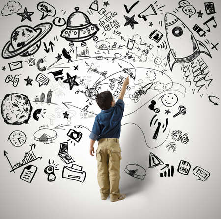 Concept of small genius with kid and varius drawingsの写真素材