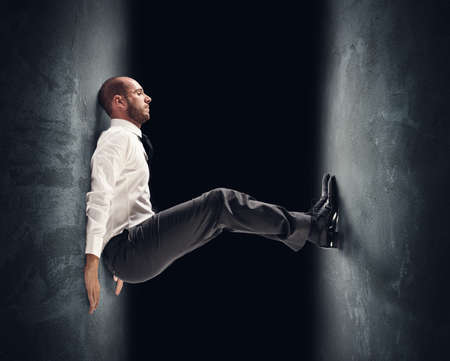 Concept of a stressed businessman under pressureの写真素材