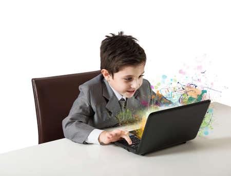Young boy working with laptop. concept of creativity and imaginationの写真素材