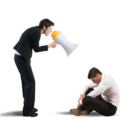 Concept of reproach with businessman shouting through a megaphoneの写真素材
