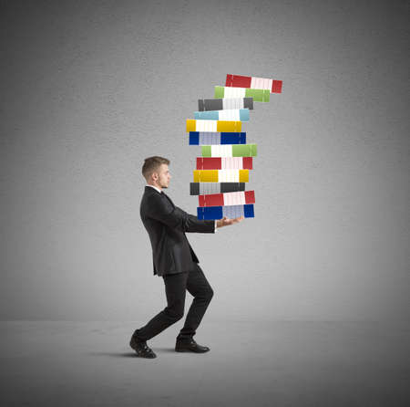 Concept of hard career with workload businessmanの写真素材