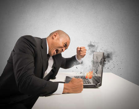 Concept of stress and frustration caused by a computerの写真素材