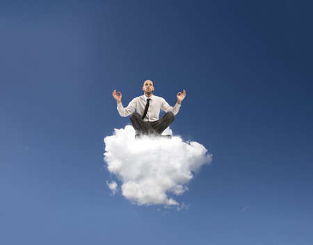 Concept of relax with businessman doing yogaの写真素材