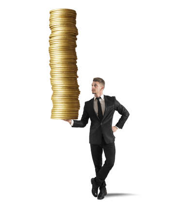 Earn money concept with businessman that holds golden coinsの写真素材