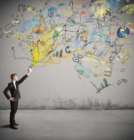 Businessman draws a creative project with a pray pantの写真素材