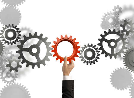 Businessman builds a business system with gearの写真素材