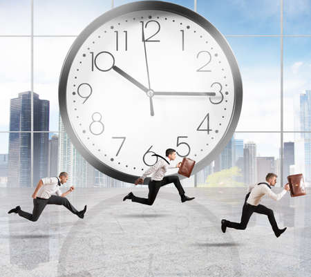 Concept of time and delay with running businessmanの写真素材