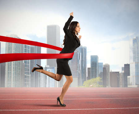 Concept of winner businesswoman in a finish lineの写真素材