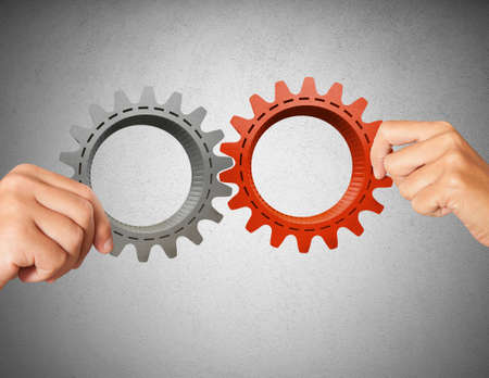 Businessman builds a business system with gearの写真素材