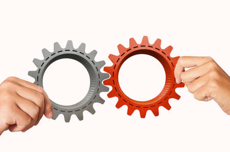 Businessman builds a business system with gearの写真素材