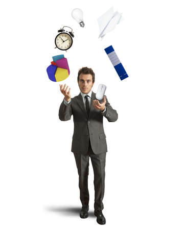 Juggler businessman playing with business objectの写真素材
