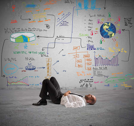 Businessman thinks about a new creative projectの写真素材