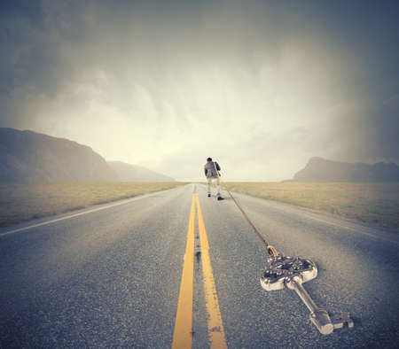 Concept of hard career with man pulls key to successの写真素材
