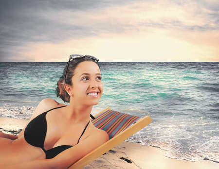 Concept of summertime with a girl on the beachの写真素材