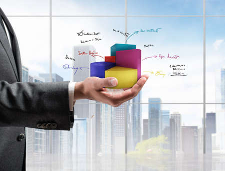 Businessman shows successful statistics of a companyの写真素材