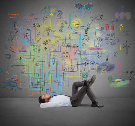 Businessman thinks about a new creative projectの写真素材