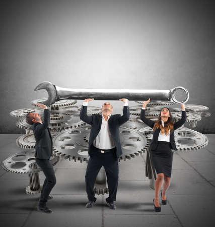 Business team makes maintenance of a system of gearsの写真素材