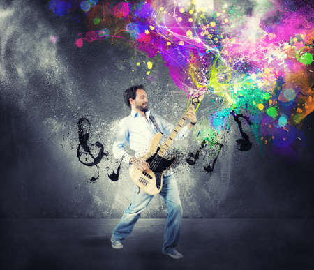 Boy play with bass guitar with colorful effect