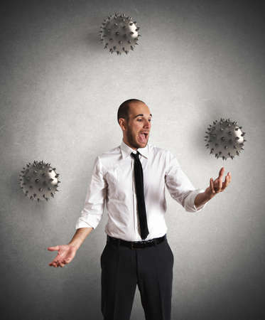 Concept of difficult business with a juggler businessmanの写真素材