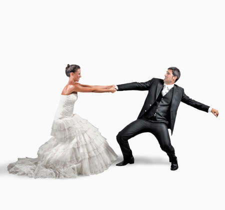 Woman holds man wants to escape from marriageの写真素材