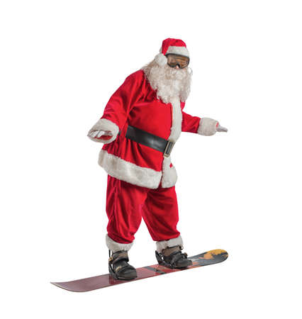 Funny santa claus goes fast on a snowboard in a tropical beachの写真素材