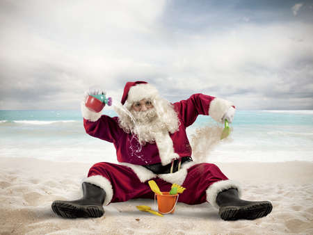 Santa Claus enjoys playing on the beachの写真素材