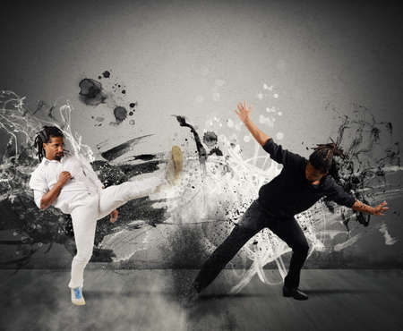 Black and white fighting in the capoeira danceの写真素材
