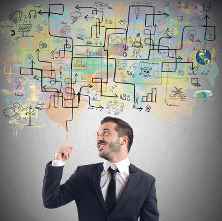 A businessman ingenious organizes a work planの写真素材