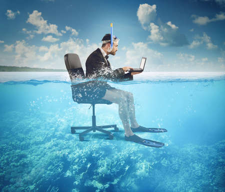 Businessman working on vacation even at sea Businessman working on vacation even at sea