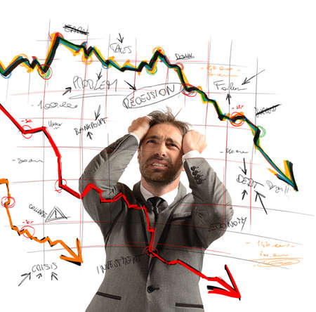 Businessman stressed out by the financial collapseの写真素材
