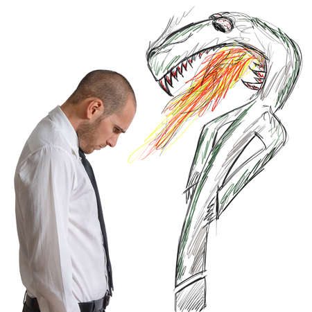 A businessman afraid by a terrible questionの写真素材