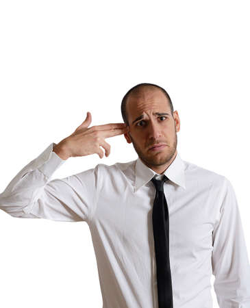 Sad businessman shoots himself for the crisisの写真素材