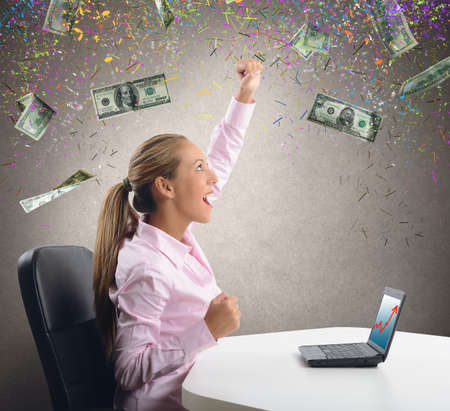 Businesswoman exults for the increase in gainの写真素材