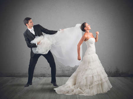 Husband pulls the veil to the brideの写真素材